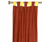 Yellow sari tab top curtains hung at a window