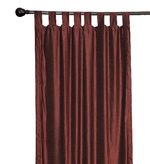 Wine velvet tab top curtains hung at a window