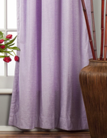 Lavender velvet tab top curtains hung at a window
