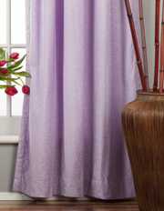 Lavender velvet tab top curtains hung at a window