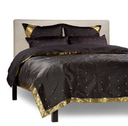 Black sari duvet cover set made up on a bed