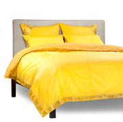 Yellow sari duvet cover set made up on a bed