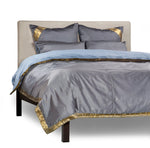 Gray sari duvet cover set made up on a bed
