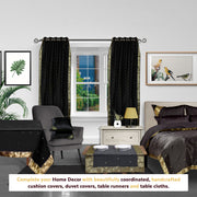 Black sari grommet top curtains hung at a window