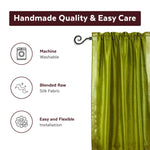 Olive green sari rod pocket curtains hung at a window