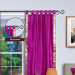 Violet sari tab top curtains hung at a window