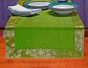 Forest green silk table runner running down a dining table