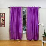Lavender sari rod pocket curtains hung at a window
