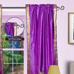 Lavender sari rod pocket curtains hung at a window
