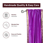 Lavender sari rod pocket curtains hung at a window