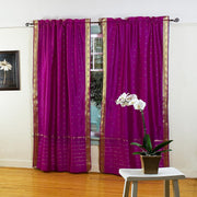 Violet sari rod pocket curtains hung at a window