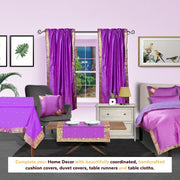 Lavender sari rod pocket curtains hung at a window