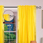 Yellow sari rod pocket curtains hung at a window