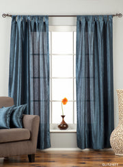 Navy blue sari tab top curtains hung at a window