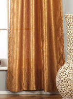 Gold sari tab top curtains hung at a window
