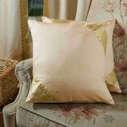 Gold sari cushion covers arranged on a sofa