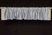 Gray sari valance mounted above a window
