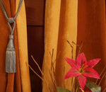 Gray sari curtain tiebacks holding a panel open