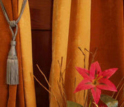 Gray sari curtain tiebacks holding a panel open