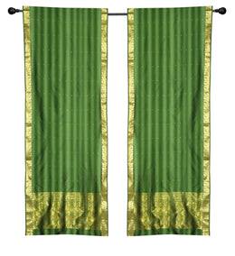 Green sari rod pocket curtains hung at a window
