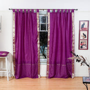 Violet sari tab top curtains hung at a window