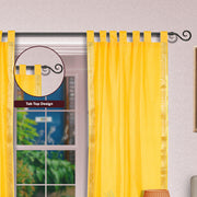 Yellow sari tab top curtains hung at a window