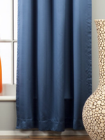 Blue sari tab top curtains hung at a window