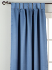 Blue sari tab top curtains hung at a window
