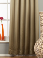 Olive green sari grommet top curtains hung at a window