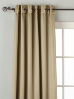 Olive green sari grommet top curtains hung at a window