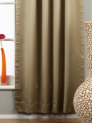 Olive green sari tab top curtains hung at a window