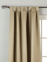 Olive green sari tab top curtains hung at a window