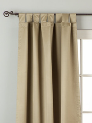 Olive green sari tab top curtains hung at a window