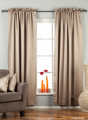 Gray sari rod pocket curtains hung at a window