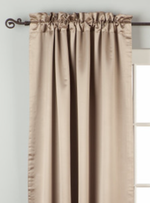 Gray sari rod pocket curtains hung at a window