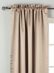 Gray sari rod pocket curtains hung at a window