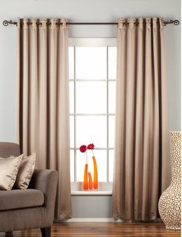 Gray sari grommet top curtains hung at a window