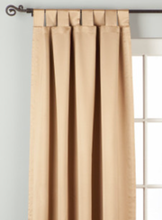 Taupe sari tab top curtains hung at a window