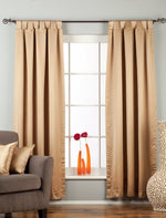 Taupe sari tab top curtains hung at a window