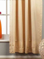 Golden rod sari rod pocket curtains hung at a window