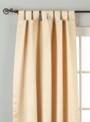 Golden sari tab top curtains hung at a window