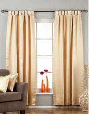 Golden sari tab top curtains hung at a window