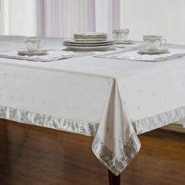 Silver sari tablecloth laid on a dining table