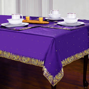 Regal purple sari tablecloth laid on a dining table