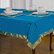 Turquoise sari tablecloth laid on a dining table