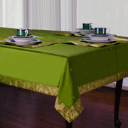 Forest green sari tablecloth laid on a dining table