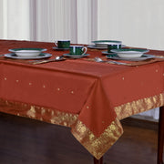 Rust sari tablecloth laid on a dining table