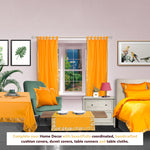 Pumpkin sari rod pocket curtains hung at a window