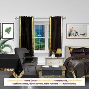 Black sari rod pocket curtains hung at a window