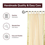 Cream sari tab top curtains hung at a window